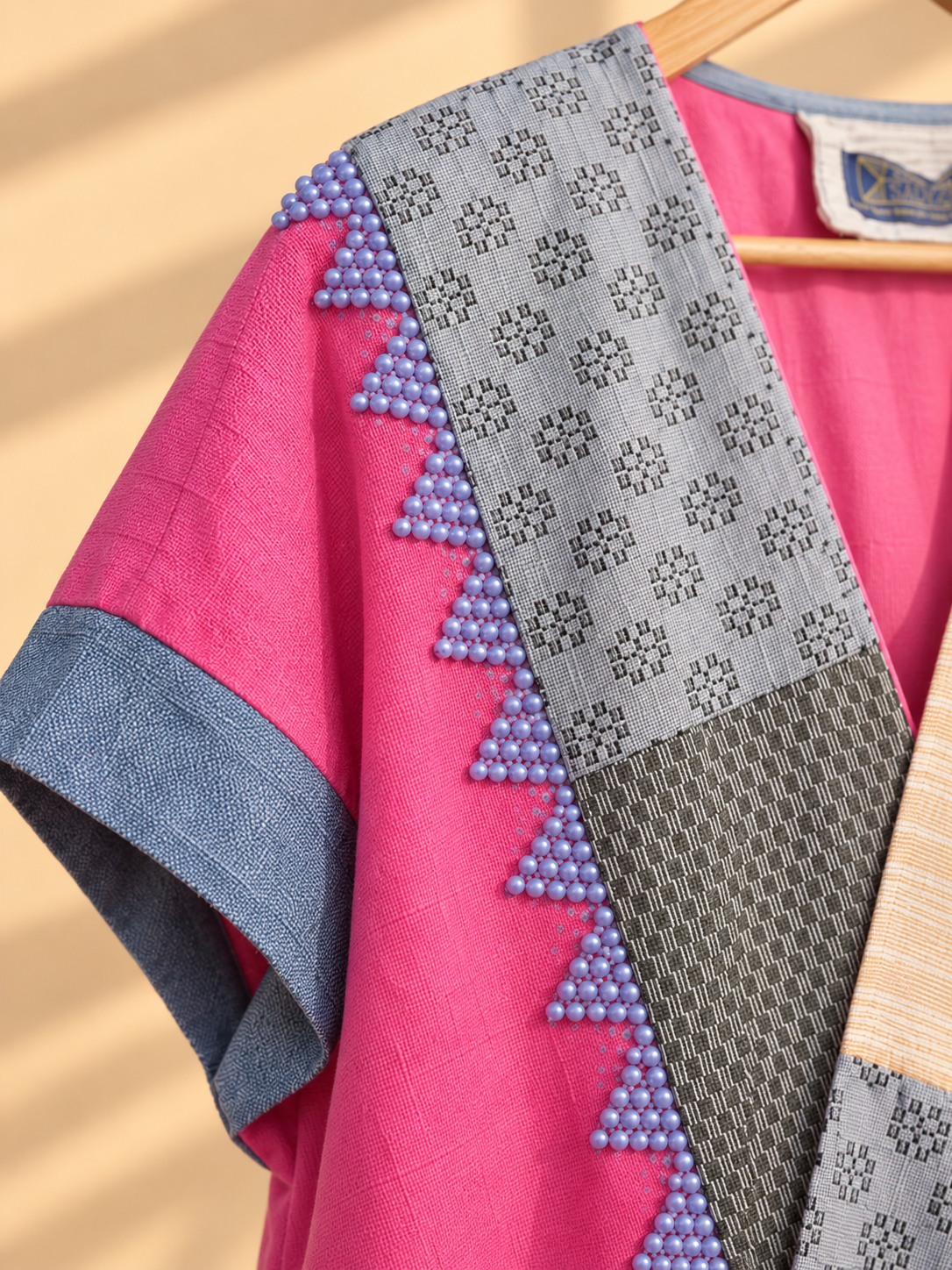HERITAGE PONCHO IN MIXED PINK WITH MULTI PATTERN WEAVE